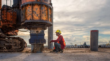 Civil engineer inspection of concrete pile driving 