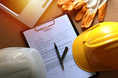 A construction contract on a table. 