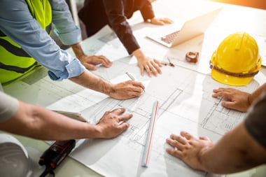 Construction workers working on a building design