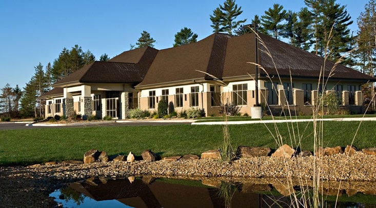 Compass Insurance headquarters exterior and pond