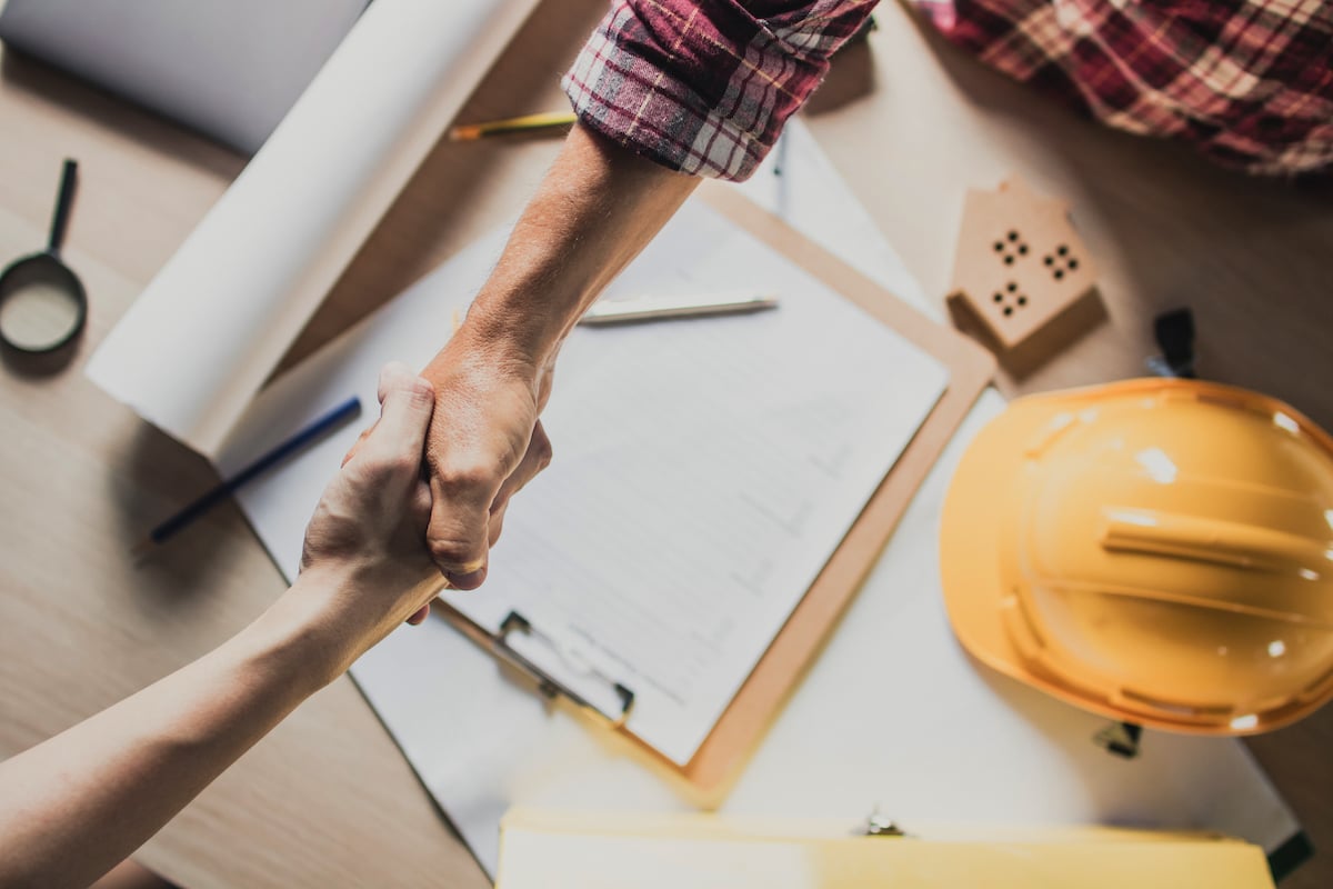 Handshake over a construction contract.